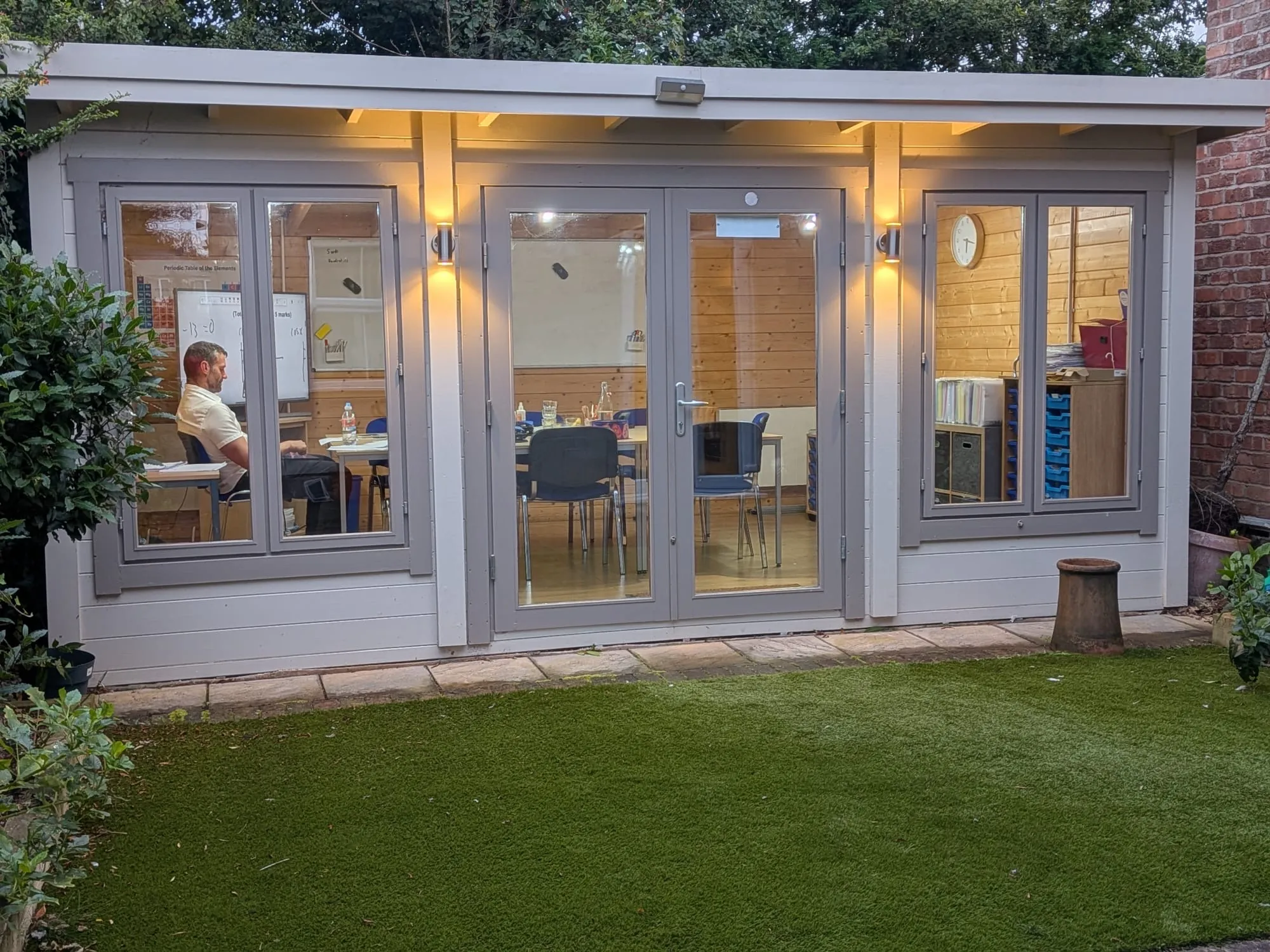 The log cabin classroom at Wilmslow Tuition Centre in the evening